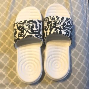 Under armor slides. Worn once.